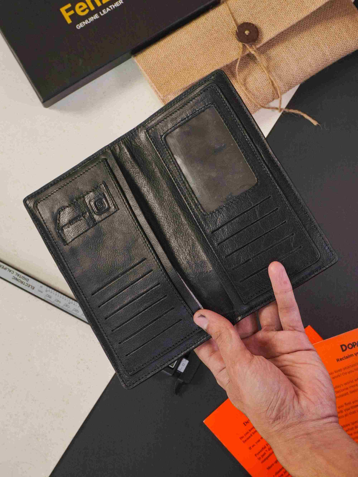 Handheld view of Fenzo classic black leather long wallet showing multi card slots and ID window