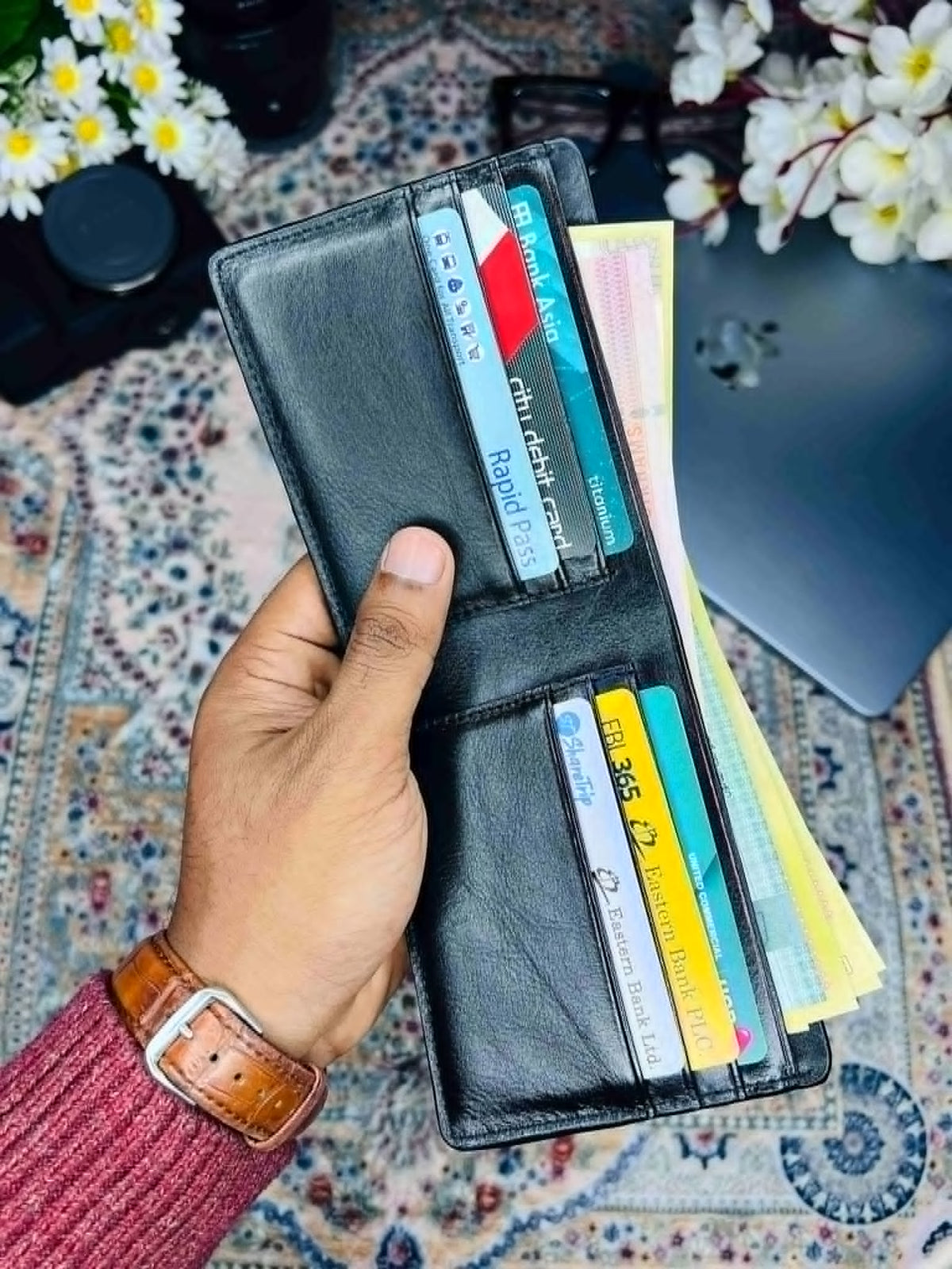 Fenzo premium leather bifold wallet for men with embossed logo on a luxury background
