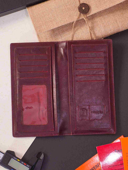 Elegant deep brown genuine leather long wallet open on a luxury flat lay setup