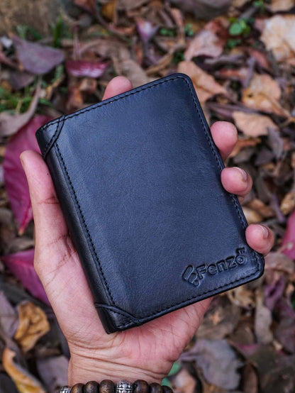 Handheld burgundy leather vertical compact wallet with multiple card compartments for a sleek aesthetic